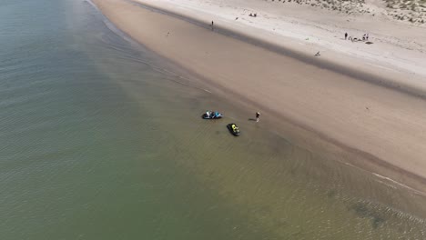 An-aerial-view-of-the-beach-in-Gravesend-Bay-in-Brooklyn,-NY-as-two-jet-ski-riders-prepare-to-ride