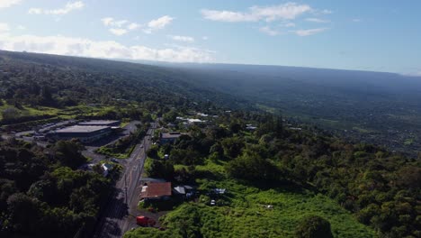 4K-cinematic-drone-shot-of-cars-driving-down-a-road-in-Captain-Cook-near-Kona-on-the-Big-Island-of-Hawaii