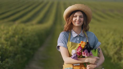 Beautiful-woman-walking-in-a-field-with-a-basket-of-tulips-and-smiling