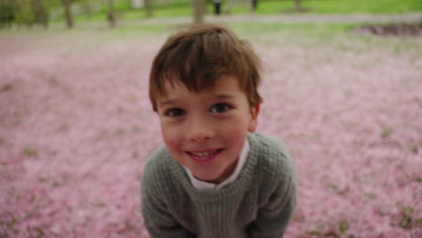 A-little-boy-is-having-fun-in-the-garden-and-his-video-is-being-made