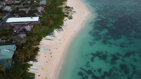 4K-cinematic-counterclockwise-drone-shot-of-outrigger-boats-on-Lanikai-Beach-during-sunrise-in-Oahu