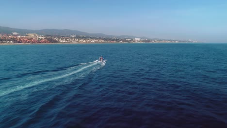 Aerial-drone-flying-over-a-motorboat-near-the-Spanish-coastline