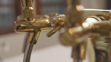Close-up-on-valves-of-beer-tap-tower