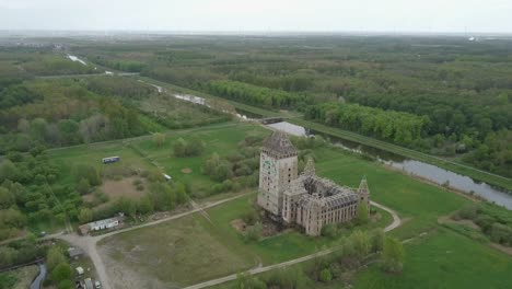 Aerial-drone-view-of-the-landscape-near-the-modern-ruin-of-Castle-Almere,-Flevoland-the-Netherlands