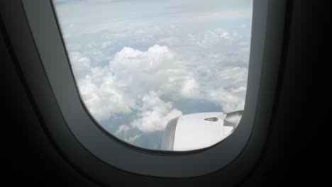 view-from-inside-cabin-of-airplane-with-view-of-sky-above-cloud,-plane-engine