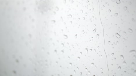 raindrop-on-the-window-surface-of-airplane-from-inside-cabin