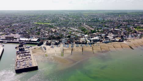 A-slow-aerial-pan-of-the-Whitstable-beach-and-harbour