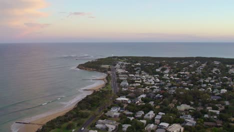 Aerial-footage-over-Point-Lonsdale-towards-the-pier-and-lighthouse-in-the-late-afternoon