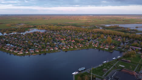 Aerial-video-footage-of-the-village-Eernewoude-and-bungalow-park-It-Wiid,-Friesland,-The-Netherlands