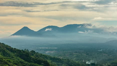 The-silhouette-of-the-Santa-Ana-and-Izalco-volcanos-during-the-afternoon-in-El-Salvador---Timelapse
