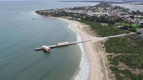 Reverse-drone-footage-of-the-Queenscliff-South-Pier,-Victoria,-Australia