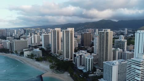 4K-cinematic-clockwise-drone-shot-of-Waikiki-Beach-and-the-towering-hotels-that-line-the-area-in-Oahu