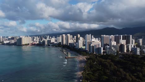 4K-cinematic-crane-drone-shot-of-the-entirety-of-Waikiki,-including-the-beach-and-hotels,-on-the-island-of-Oahu
