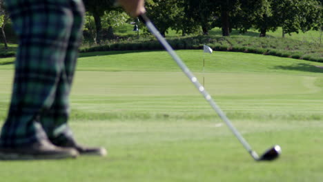 Slow-motion-man-hitting-iron-on-golf-course-HD