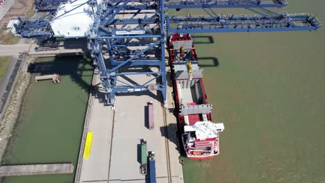 Quay-cranes-loading-London-Thamesport,Container-port-river-Medway-Kent-UK-drone-aerial-view