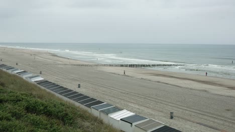 Panoramic-shot-of-the-coast-of-the-North-Sea-near-the-city-of-Domburg-on-a-cloudy-spring-day