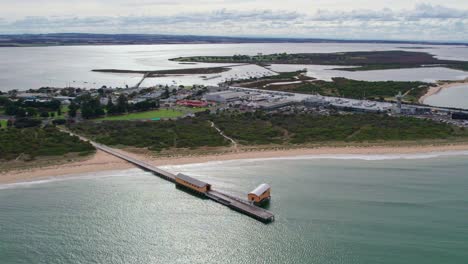 Slow-drone-view-of-the-Queenslcliff-South-Pier-and-Queenscliff-Habour-with-Swan-Island-in-the-background