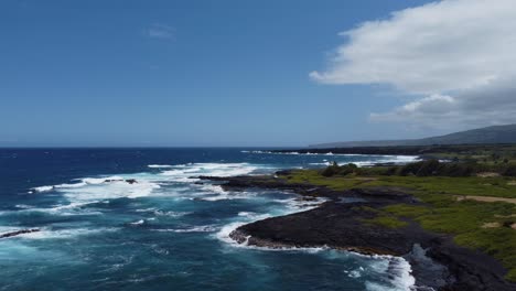 4K-cinematic-zoom-out-drone-shot-of-waves-hitting-the-lava-rock-coastline-near-Punulu'u-Black-Sand-Beach-on-the-Big-Island-of-Hawaii