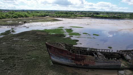 Shipwreck-on-salt-marshes-river-medway-Kent-UK-drone-aerial-view