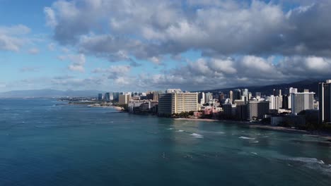4K-cinematic-drone-shot-of-Waikiki-Beach-and-the-Oahu-coastline-from-high-over-the-ocean-following-sunrise