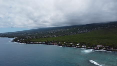 4K-cinematic-pan-drone-shot-of-the-tropical-lava-rock-coastline-in-Kona-on-the-Big-Island-of-Hawaii-on-a-cloudy-day
