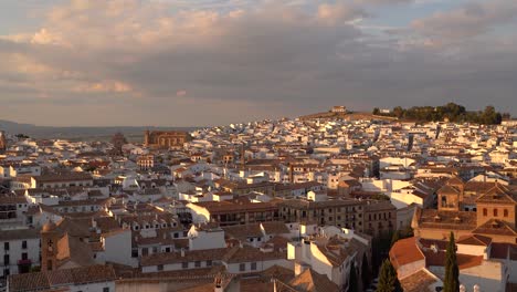 Incredible-sunset-panorama-tilt-up-over-Antequera-city-in-Andalusia,-Spain