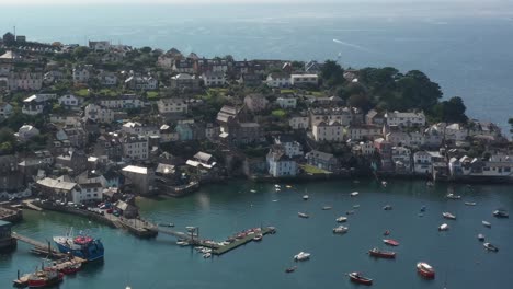 Aerial-view-of-the-town-of-Polruan,-and-Polruan-castle-on-the-Cornish-coast,-UK