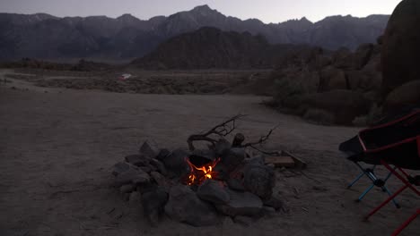 Campfire-at-dusk-near-Alabama-Hills,-California