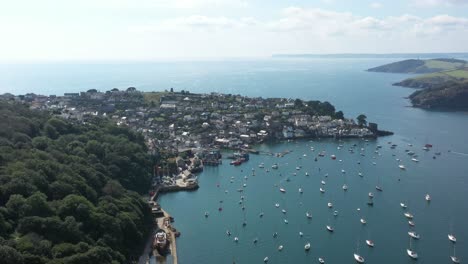 Wide-aerial-view-of-the-Cornish-town-of-Polruan,-on-the-River-Fowey-in-South-Cornwall,-UK