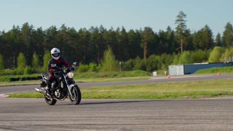 Motorbike-Rider-Takes-Turn-on-Racing-Track-on-Competition-Day