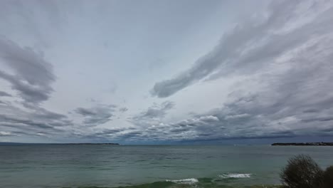 Timelapse-of-storm-clouds-looking-across-The-Rip-and-out-through-the-heads-of-Port-Philip-Bay,-southern-Victoria,-Australia