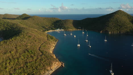Aerial:-British-Virgin-Islands---Orbiting-view-of-Normand-Island-at-sunset