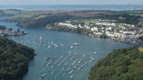 Wide-aerial-view-from-the-coastal-town-of-Fowey,-revealing-Polruan-on-the-river-Fowey,-Cornwall,-UK