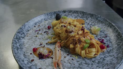 Close-up-shot-of-a-plate-full-of-pasta-and-scampi-made-from-a-professional-chef-in-Italy---01