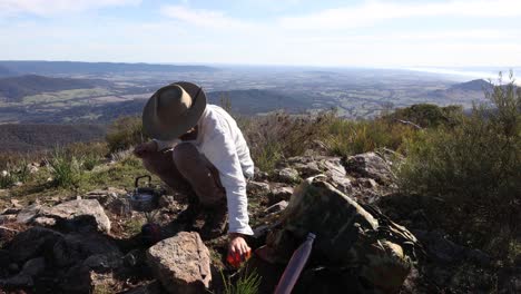 A-bushman-boils-a-billy-on-top-of-a-mountain-in-the-high-country-of-Victoria-to-make-some-bush-tea