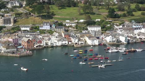 Aerial-view-of-boats-moored-in-Fowey-harbour,-on-the-River-Fowey-in-Cornwall,-UK