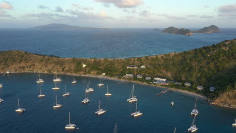Aerial:-British-Virgin-Islands---Cooper-Island---Drone-shot-backward-revealing-moored-yachts-at-sunset