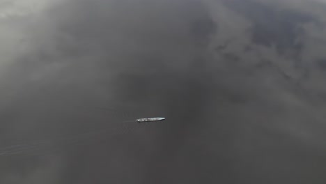 Aerial-View-Of-A-Sailing-Boat-On-Laguna-Negra-Near-Boquerón-De-Perico-In-Colombia