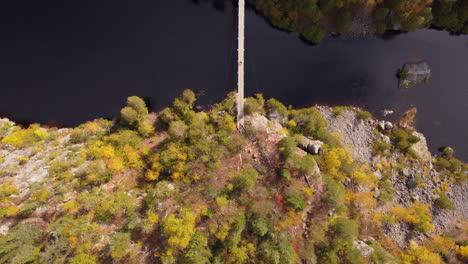 Man-crossing-suspension-bridge-in-aiguebelle-national-park