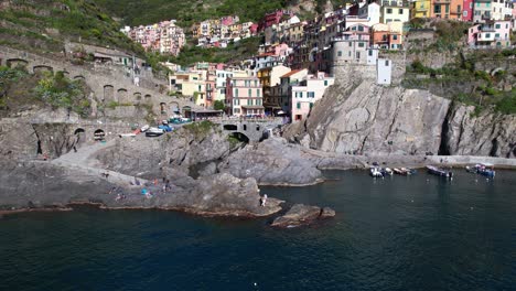 Coast-of-Manarola-City-with-Beautiful-Colorful-Houses,-Italy-in-Aerial-View