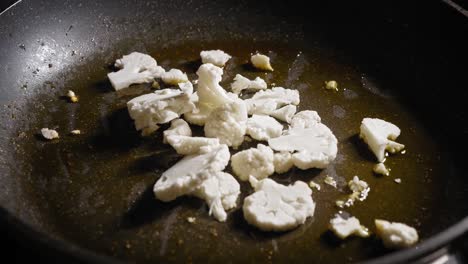 Sauteing-Chopped-Cauliflower-In-A-Pan-With-Butter