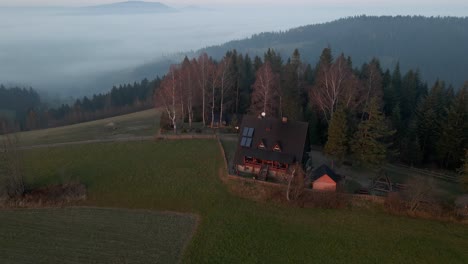 Aerial-shot-of-a-house-in-the-mountain