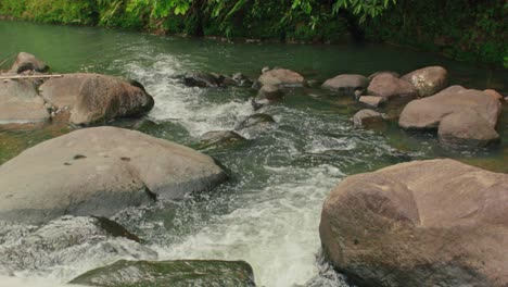 A-peaceful-river-flows-on-a-remote-summer-destination