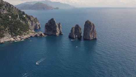 Exotic-Tourist-Destination-in-Italy,-Capri,-Faraglioni-Rocks,-Aerial-View