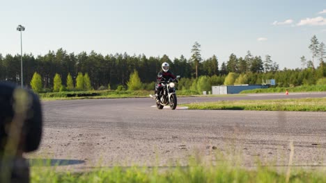 Revving-up-motorcycle-with-wheelie-on-racetrack-at-Latvia
