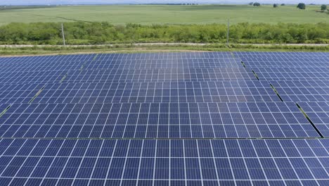 Sideways-flyover-above-El-Soco-solar-photovoltaic-panels-installed-at-San-Pedro-De-Macoris-in-Dominican-Republic