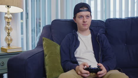 Young-man-is-disappointed-while-playing-video-games