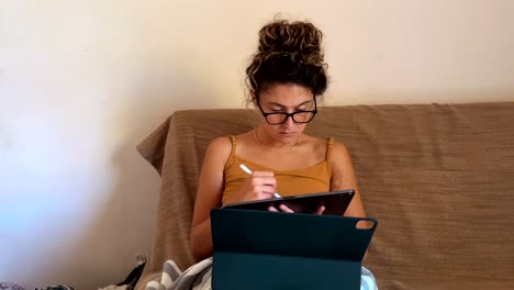 Native-American-woman-working-from-home-on-tablet