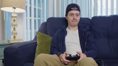 Young-man-flinches-while-focused-on-video-game
