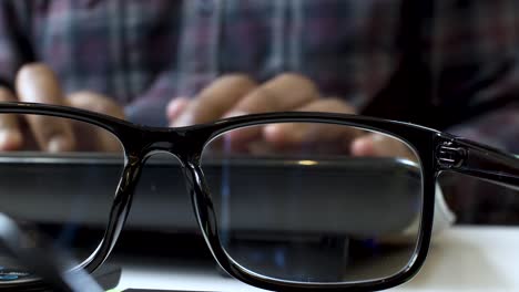 Glasses-in-Black-Frame,-Closeup-of-Hands-Typing-on-Keyboard